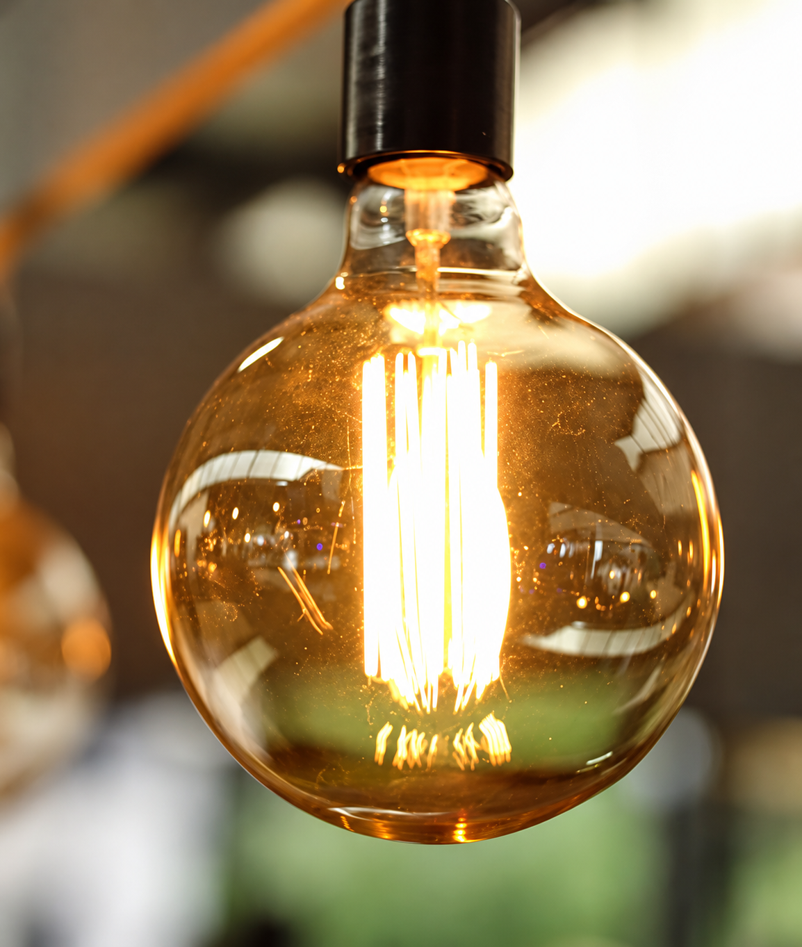 Warm glowing globe filament bulb